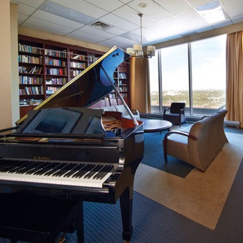 Photo of a piano in a library
