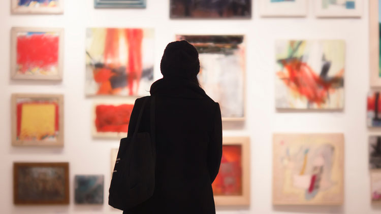 Image of woman looking at art